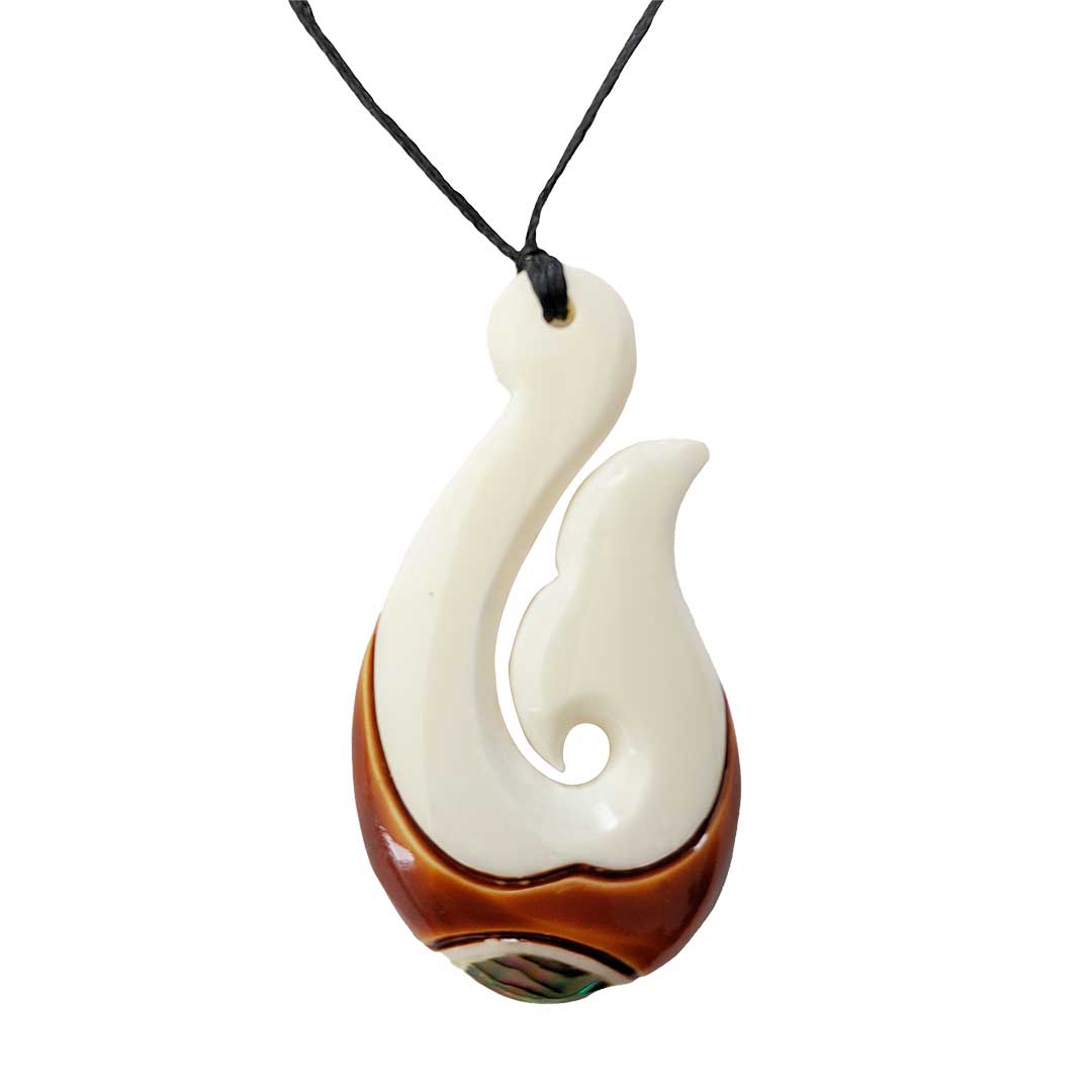 http://silverfernz.com/cdn/shop/products/Bone-Fish-Hook-Pendant-with-Paua-and-Stain.jpg?v=1669275776
