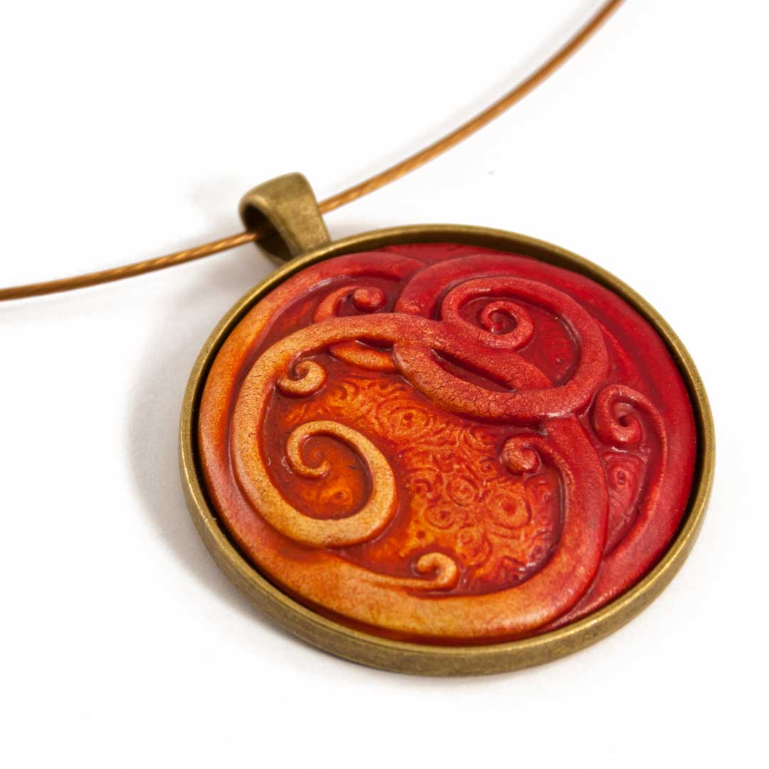 Ceramic Curled Red Koru Pendant by Craig Fletcher Angle